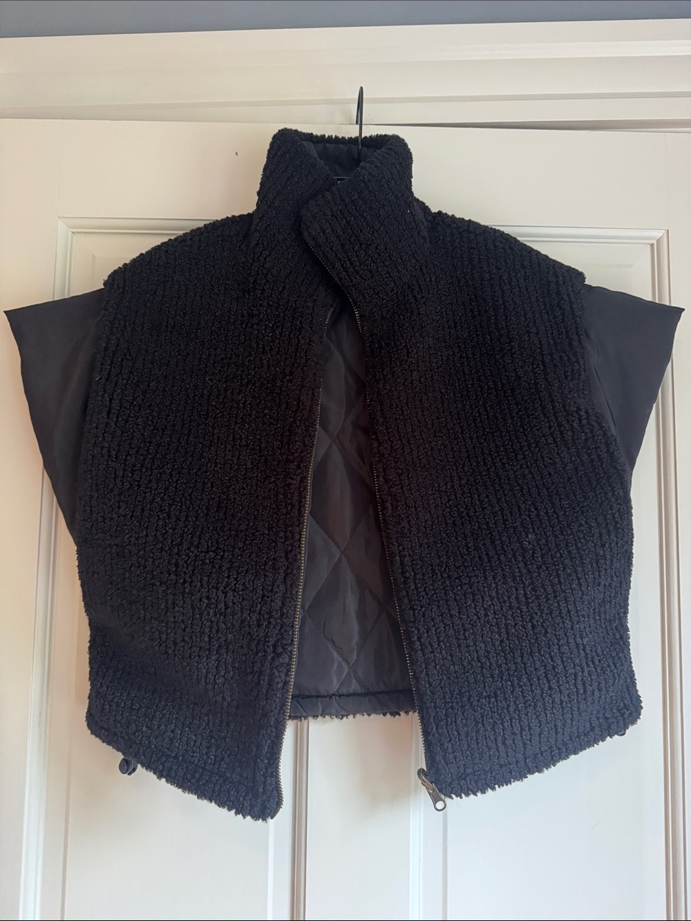 Black Textured Sherpa Reversible Vest with Quilted Panel, slight crop
